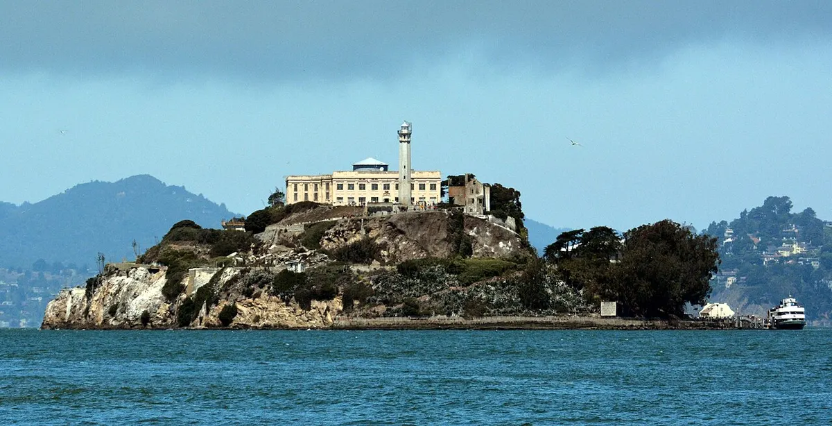 Alcatraz Island with its lighthouse and cellhouse rising from San Francisco Bay