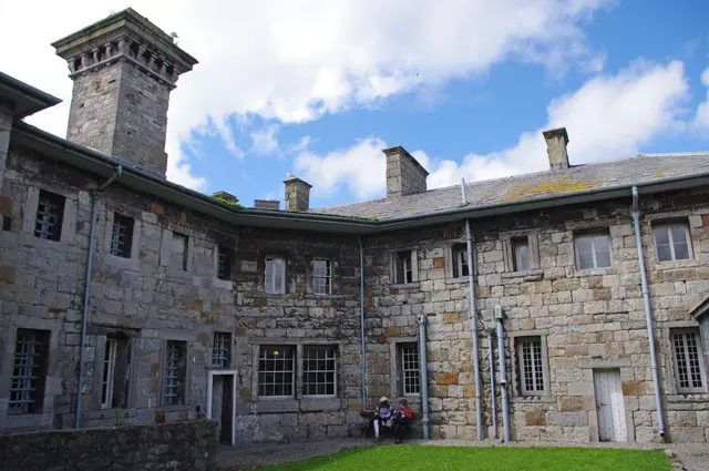 The stone walls and barred windows of Beaumaris Gaol, a Victorian prison on Anglesey