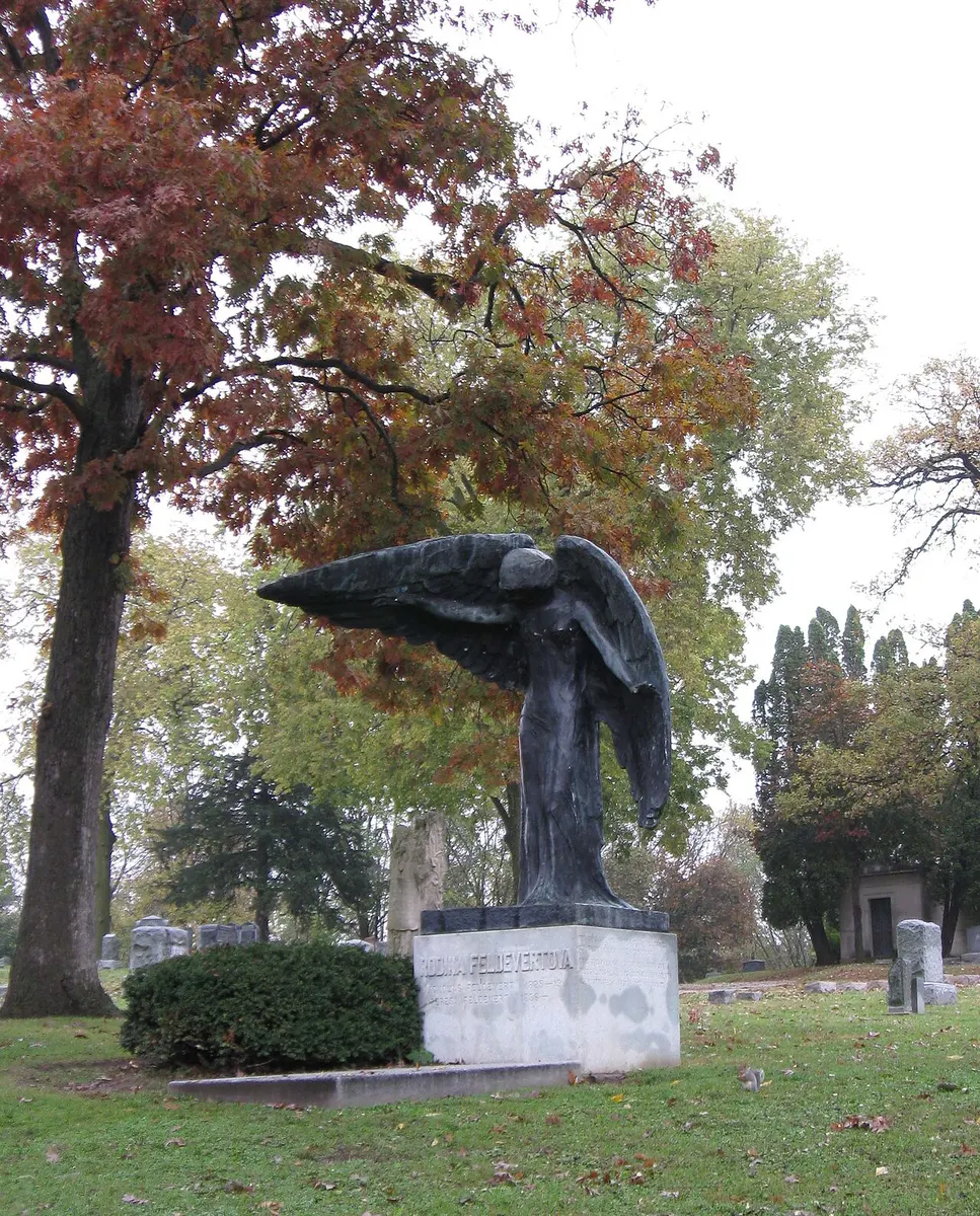 The dark bronze Black Angel statue in Oakland Cemetery, Iowa City