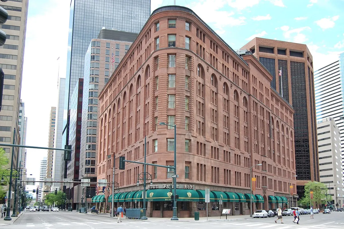 The triangular red-granite and sandstone Brown Palace Hotel in downtown Denver
