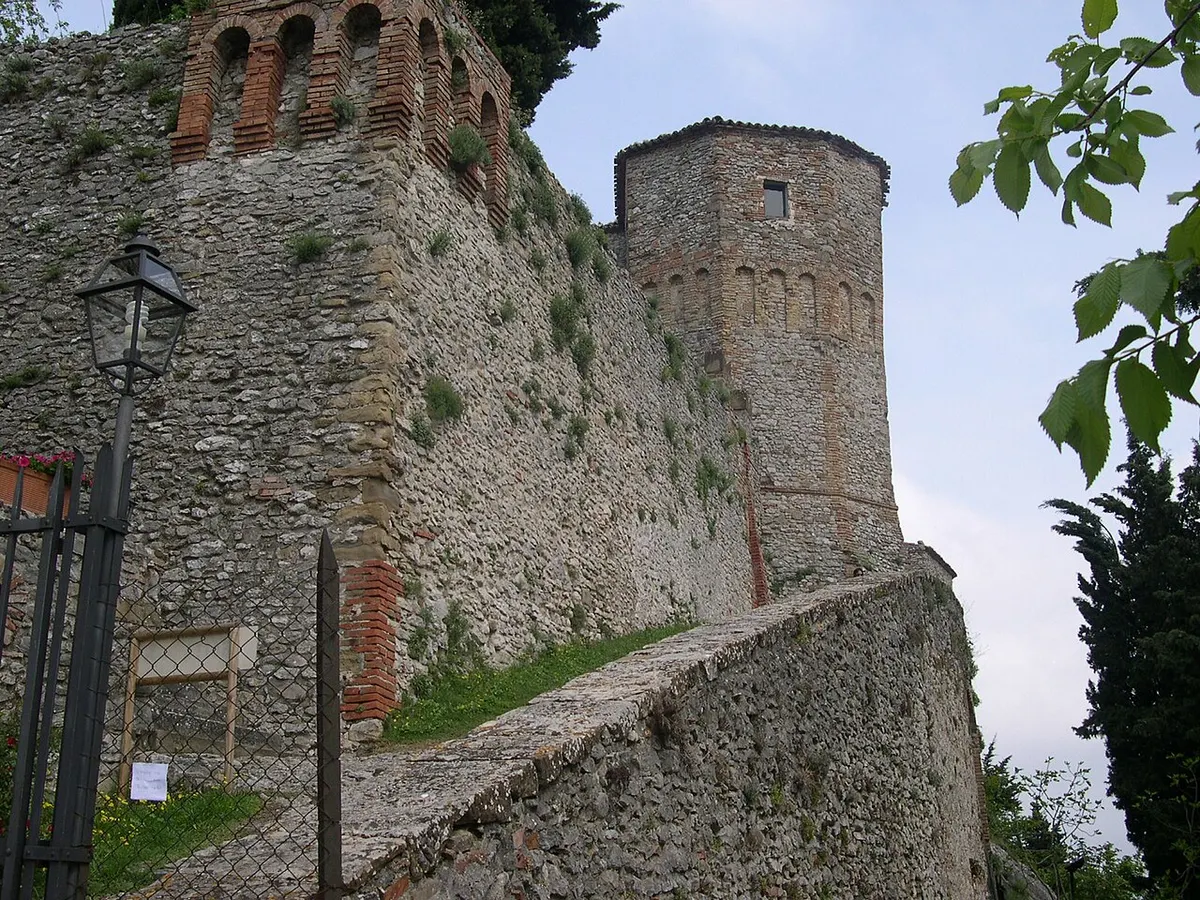 Stone walls and a round tower of the castle of Montebello di Torriana