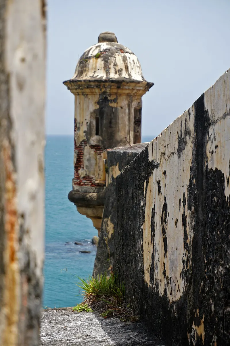 A stone garita sentry box on the walls of Castillo San Felipe del Morro above the sea