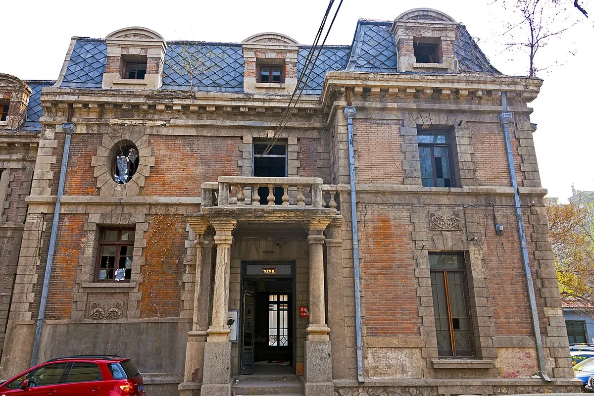 Front of the main house at Chaonei No. 81 in Beijing, a grey-brick French Baroque building with a mansard roof