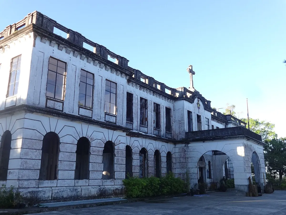 Front of the former Diplomat Hotel on Dominican Hill, Baguio, a white two-storey building with a crenellated roofline