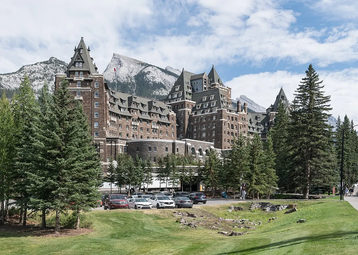 The stone château-style Fairmont Banff Springs Hotel among forested mountains