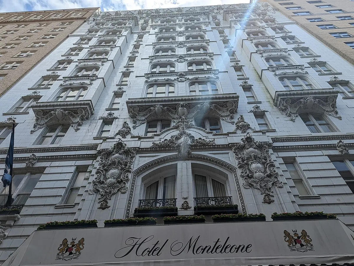 The Beaux-Arts façade and illuminated sign of the Hotel Monteleone in New Orleans’ French Quarter