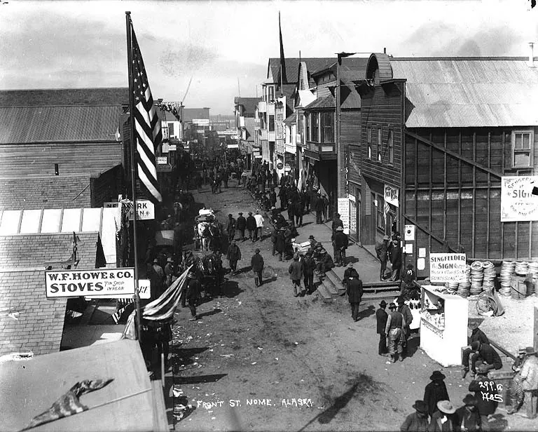 Front Street in Nome, Alaska, around 1900, with crowds and wooden storefronts