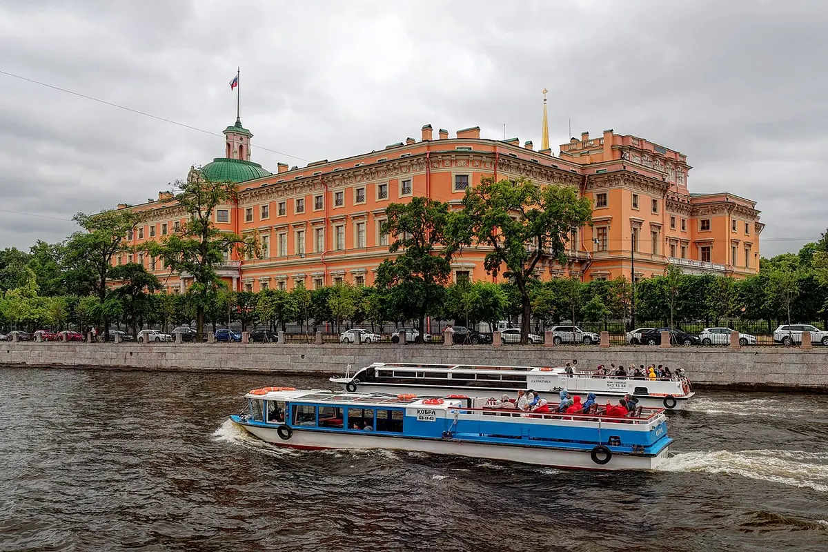 The ochre façade and spire of Mikhailovsky Castle in Saint Petersburg