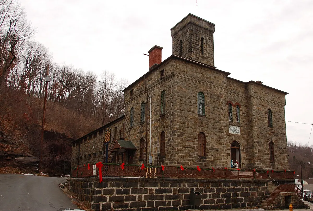 The rusticated stone front and side of the old Carbon County Jail in Jim Thorpe