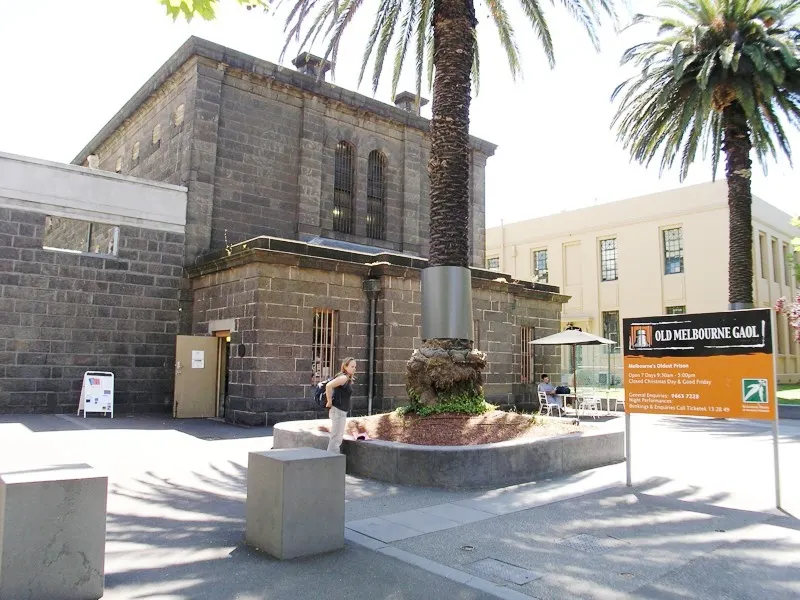 The bluestone walls and entrance of the Old Melbourne Gaol on Russell Street