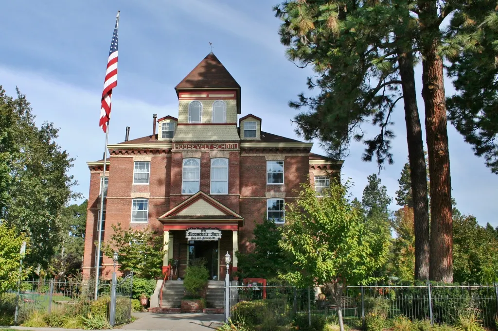 The brick Roosevelt School building in Coeur d’Alene, Idaho, with its bell tower