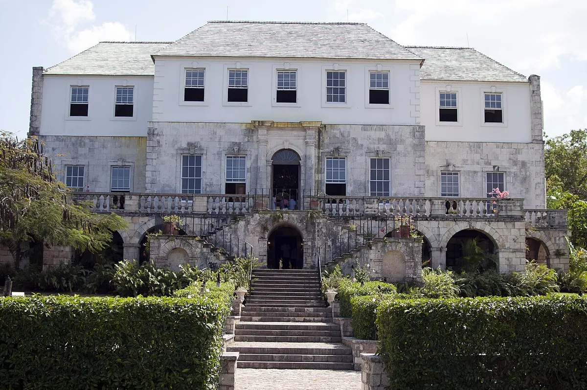 The white Georgian façade and double staircase of Rose Hall Great House in Jamaica