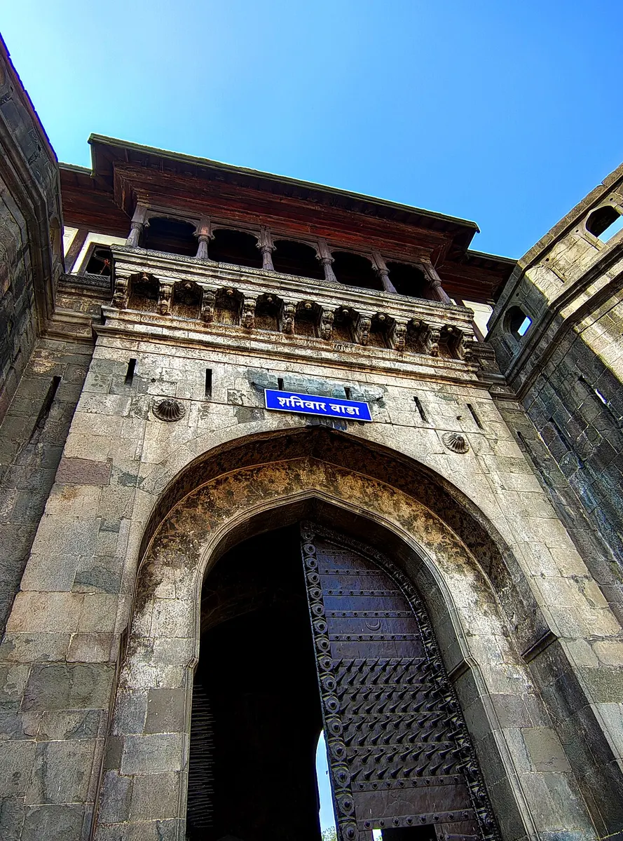 The main entrance of Shaniwar Wada in Pune, a massive gatehouse set in high stone ramparts