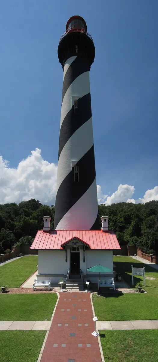 The black-and-white spiral-striped St. Augustine Lighthouse with its red lantern room