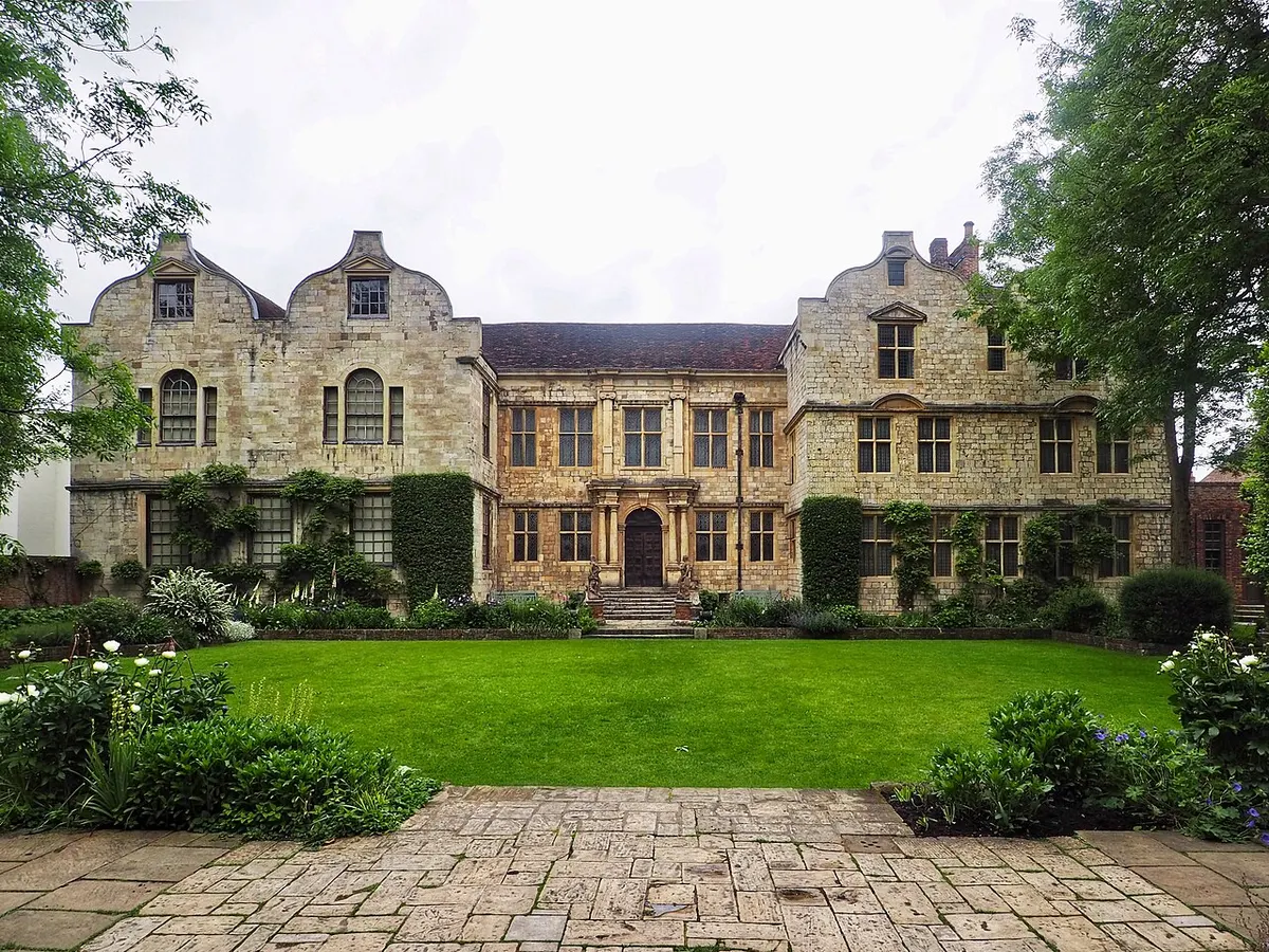 The symmetrical gabled front of Treasurer’s House behind its garden walls in Minster Yard, York