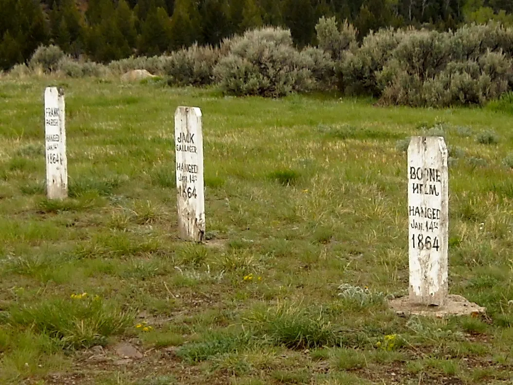 Wooden grave markers of road agents hanged in 1864 on Boot Hill above Virginia City, Montana
