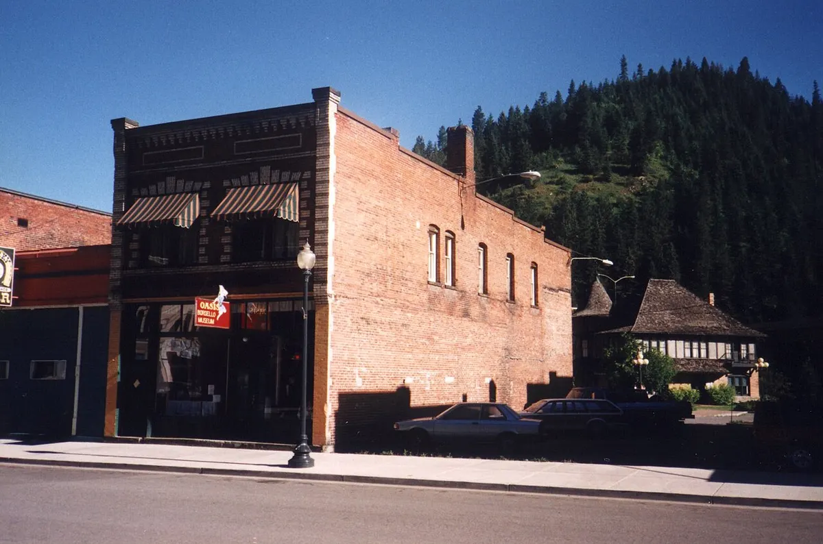 The brick Oasis Bordello Museum building on a street in Wallace, Idaho