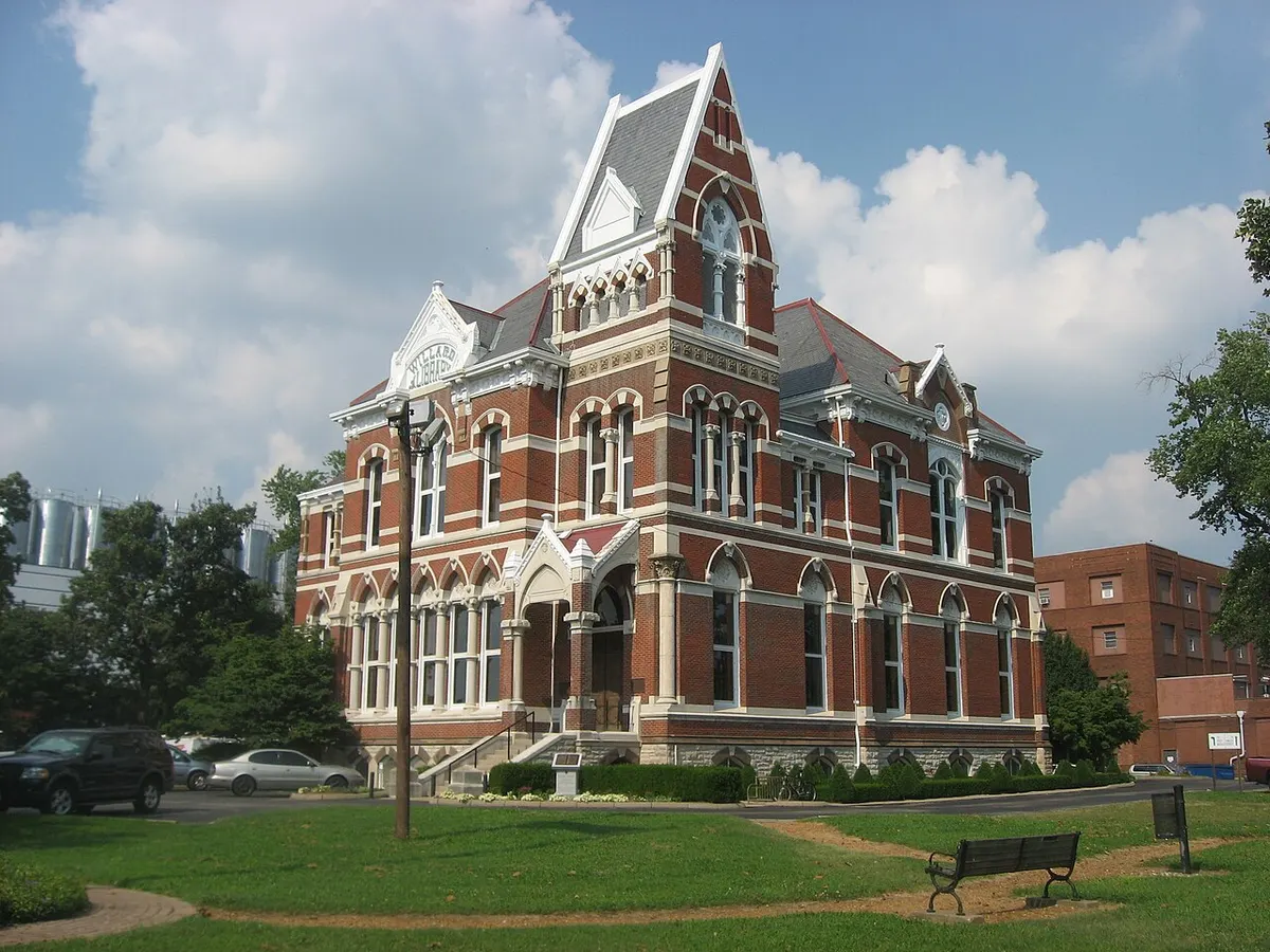 The red and cream brick Victorian Gothic Willard Library building in Evansville, seen from the southwest