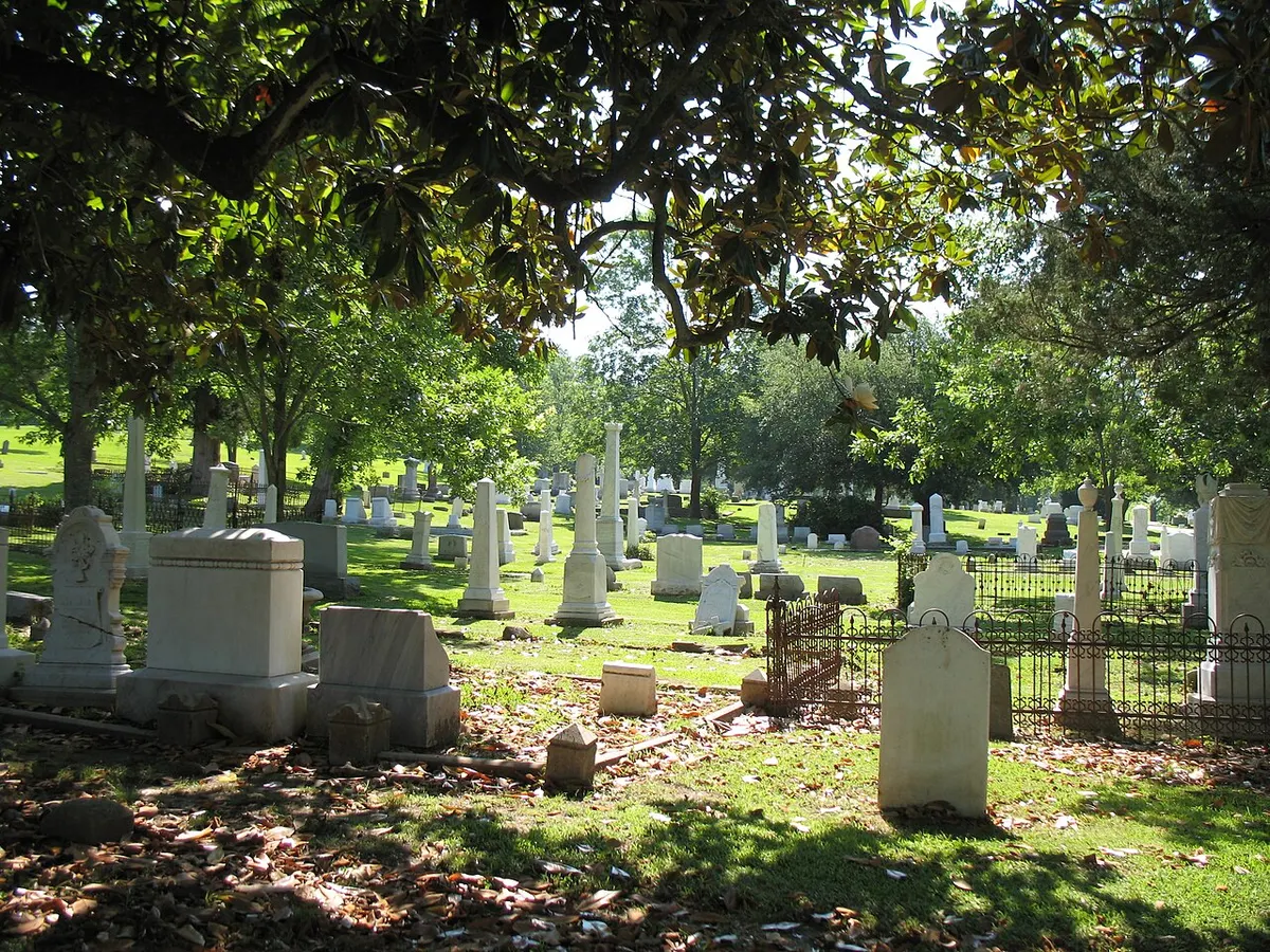 Old gravestones beneath trees in Glenwood Cemetery, Yazoo City, Mississippi