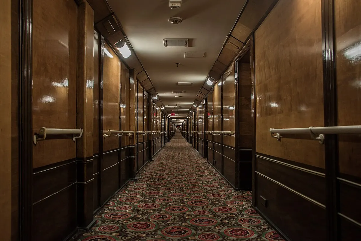 A long, narrow corridor inside the RMS Queen Mary
